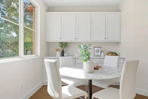 a view of a dining room with furniture window and outside view