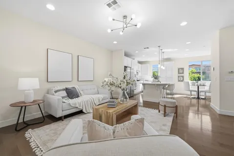 a living room with furniture and a lamp