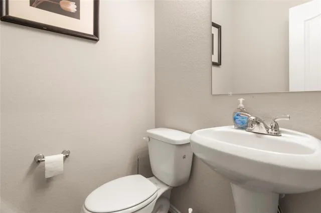 a kitchen with a sink stove and microwave