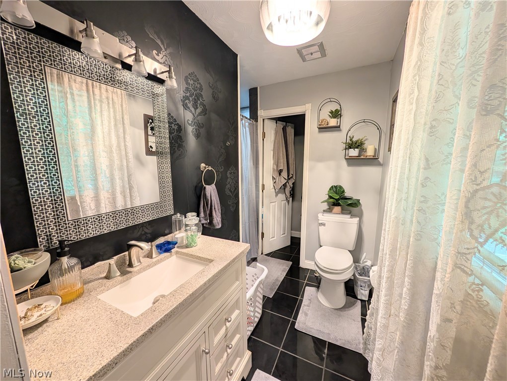 6700 McCaslin Road Nashport, OH 43830 - Photo 24 of 30 Bathroom featuring a white vanity with an integrated sink and light-colored countertop