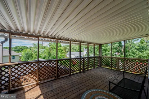 a view of a roof deck with wooden floor