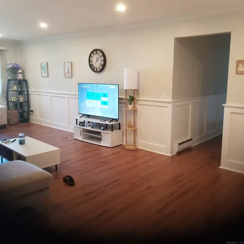 a kitchen with a sink a refrigerator and cabinets