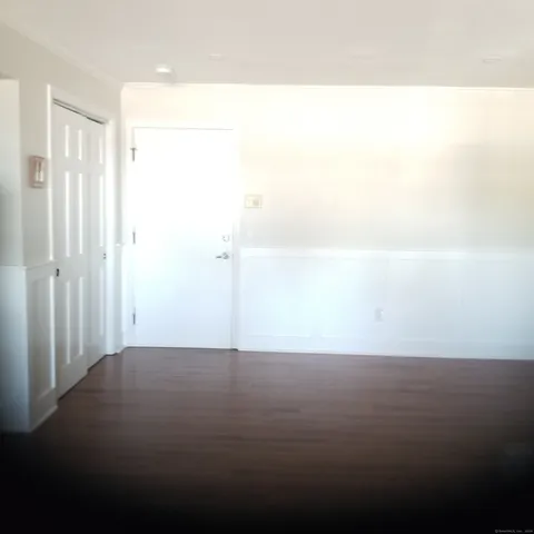 a bedroom with a bed and a desk