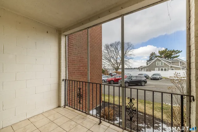 a view of an empty room with a ceiling fan