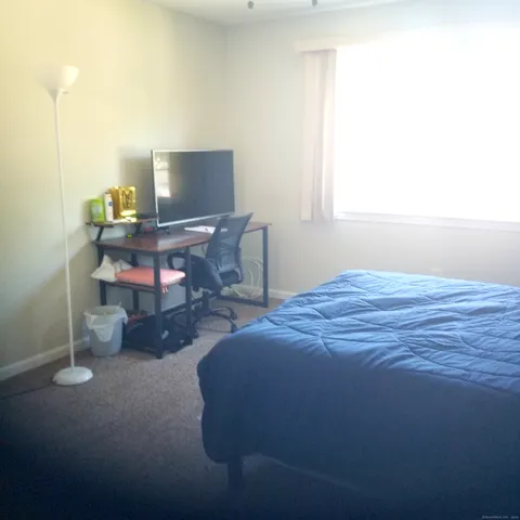 a view of room with a window and ceiling fan