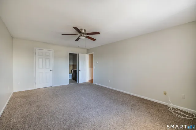 a bathroom with a sink toilet and a mirror