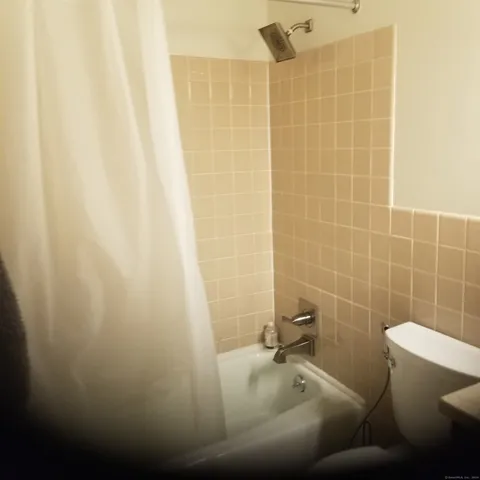 a bed room with a bed and a window