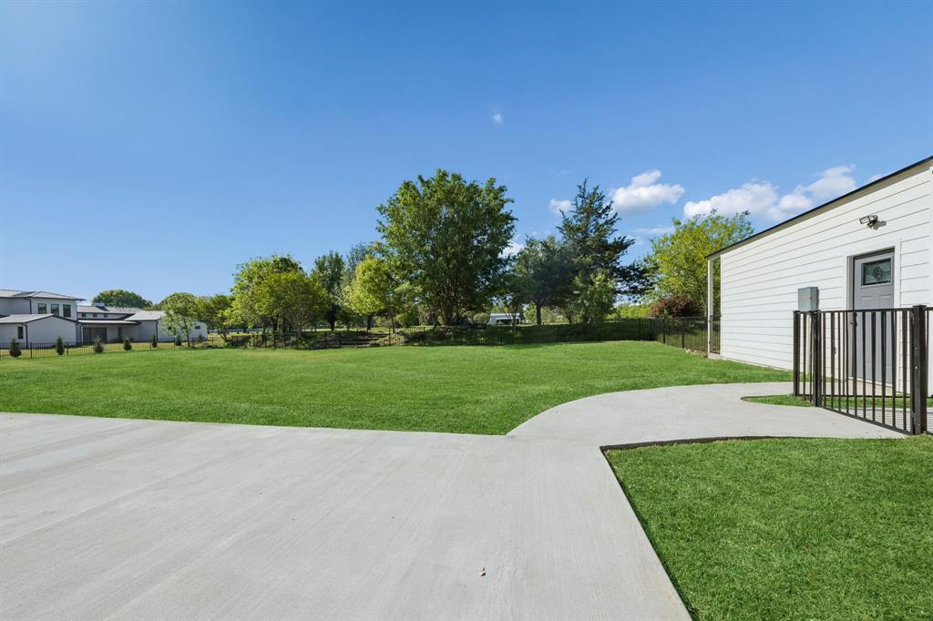 1260 Stacy Road Fairview, TX 75069 - Photo 39 of 40 Large patio is perfectly laid out for covered entertaining area with breezeway to garage