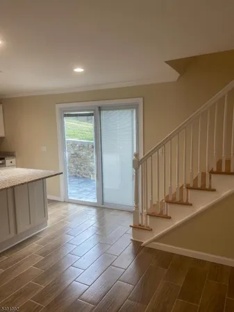a view of entryway with wooden floor