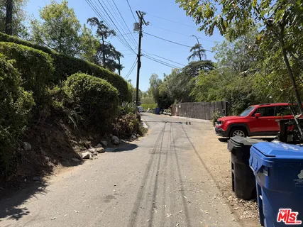a view of yard with car parked
