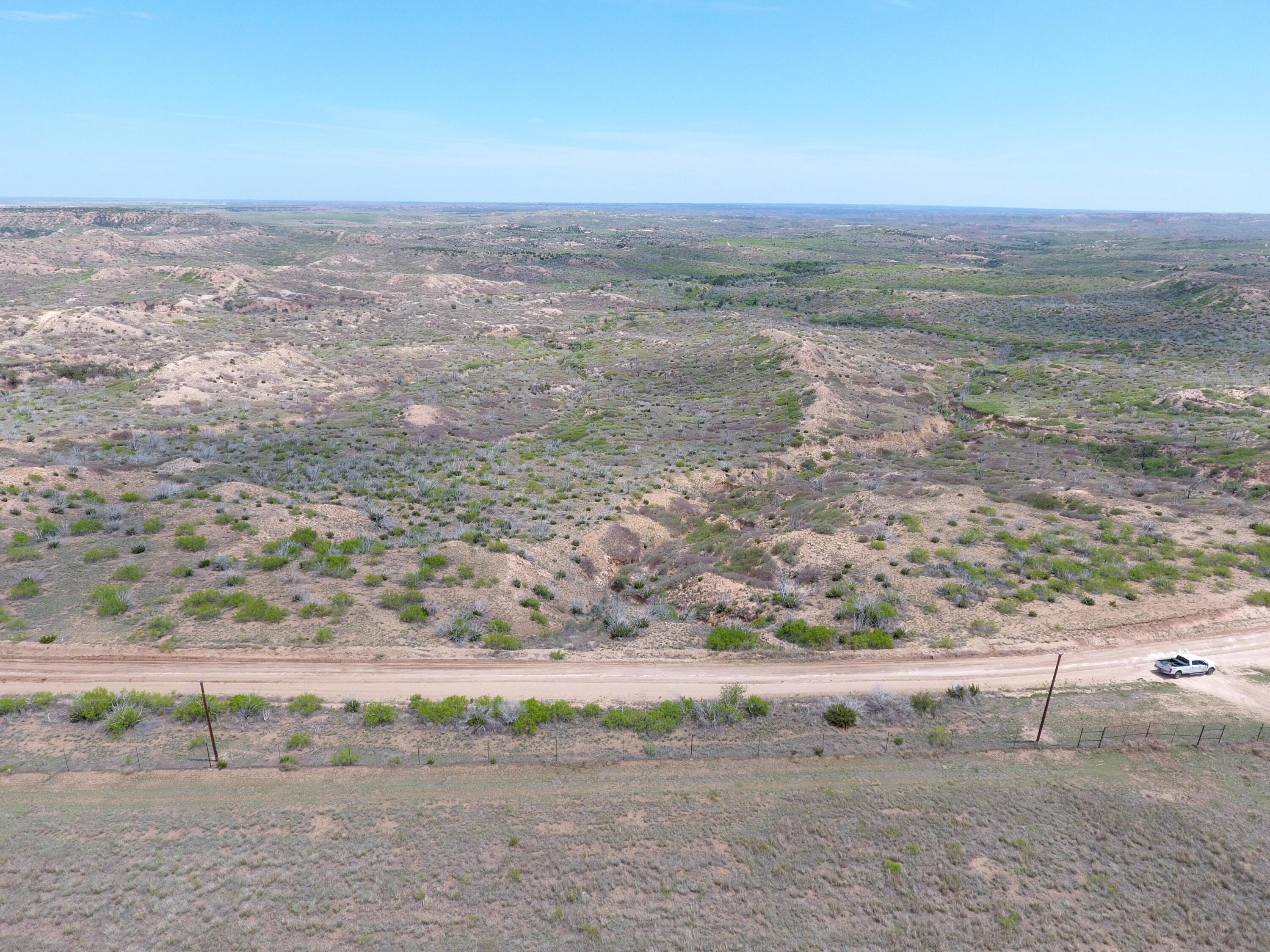 T6 County Road 22 Claude, TX 79019 - Photo 5 of 13 a view of a dry yard with wooden floor