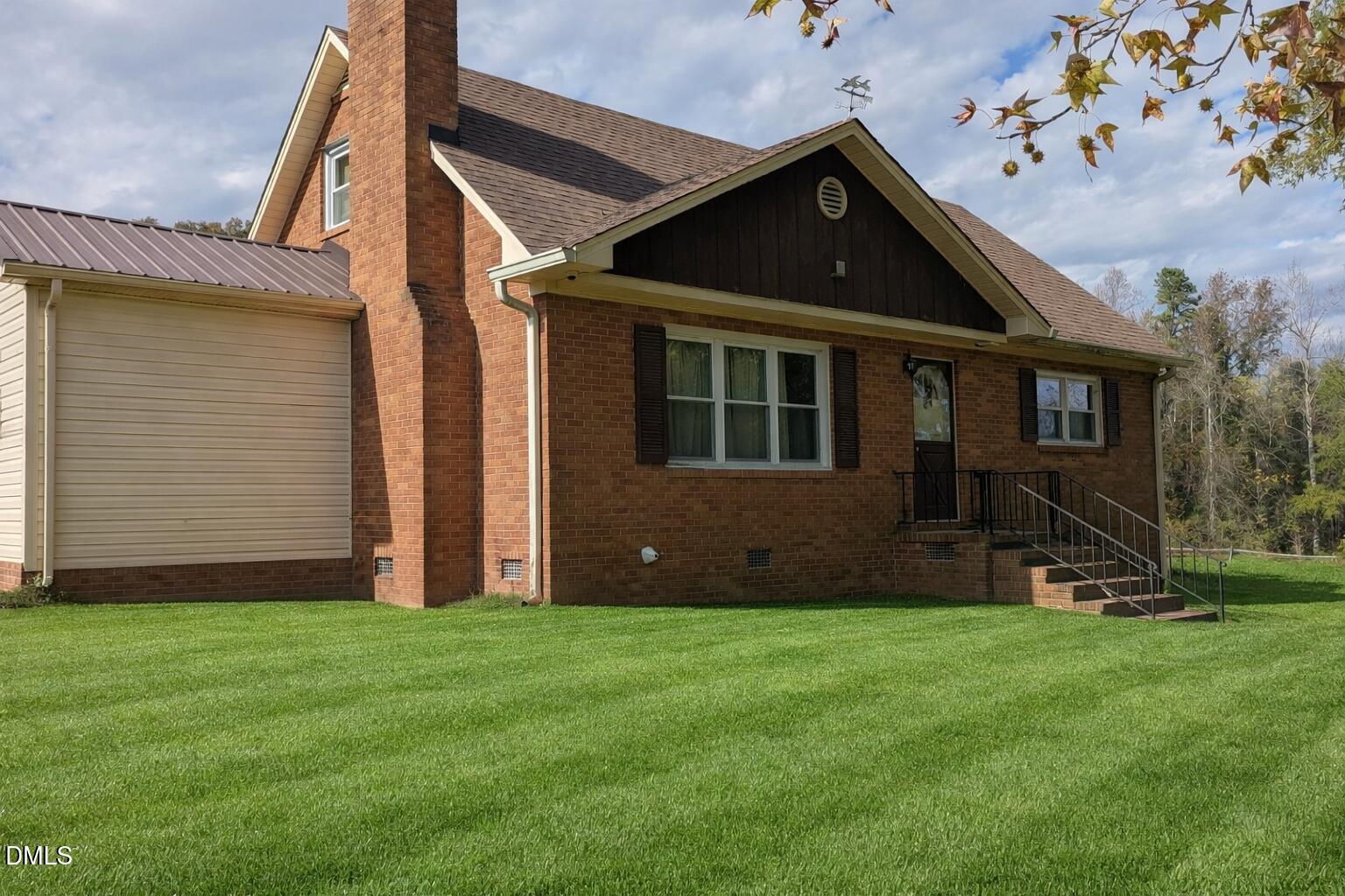 5950 Union Ridge Road Burlington, NC 27217 - Photo 3 of 24 a front view of a house with a yard