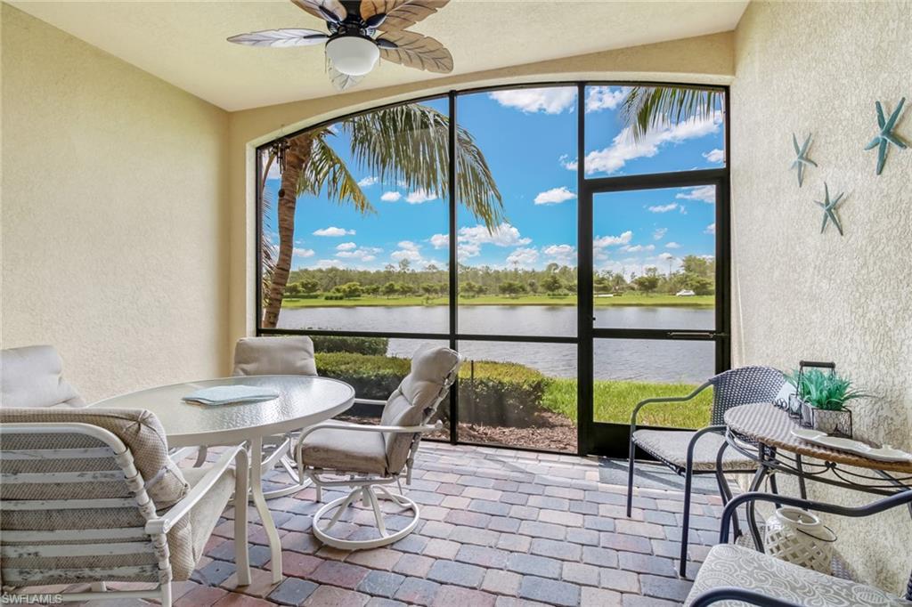 9514 Avellino Way, Unit 2116 Naples, FL 34113 - Photo 20 of 30 a living room with furniture and a large window