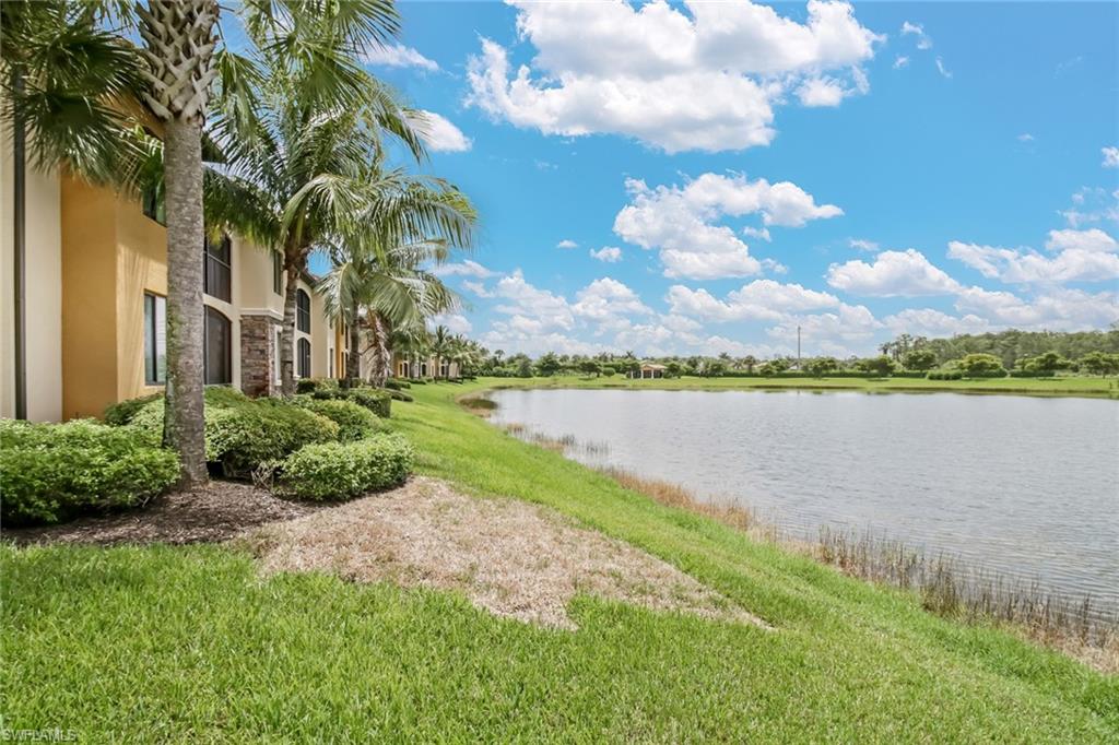 9514 Avellino Way, Unit 2116 Naples, FL 34113 - Photo 22 of 30 a view of a lake with a big yard