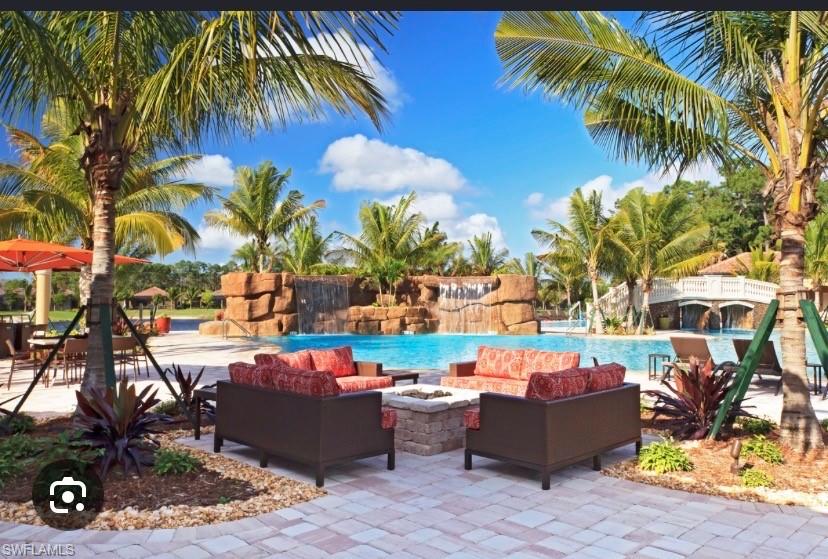 9514 Avellino Way, Unit 2116 Naples, FL 34113 - Photo 25 of 28 a view of swimming pool with outdoor seating and plants