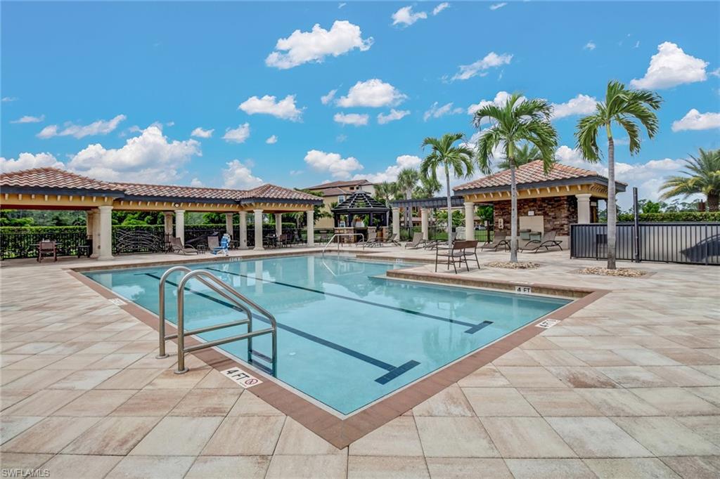 9514 Avellino Way, Unit 2116 Naples, FL 34113 - Photo 27 of 30 a view of a building with a swimming pool