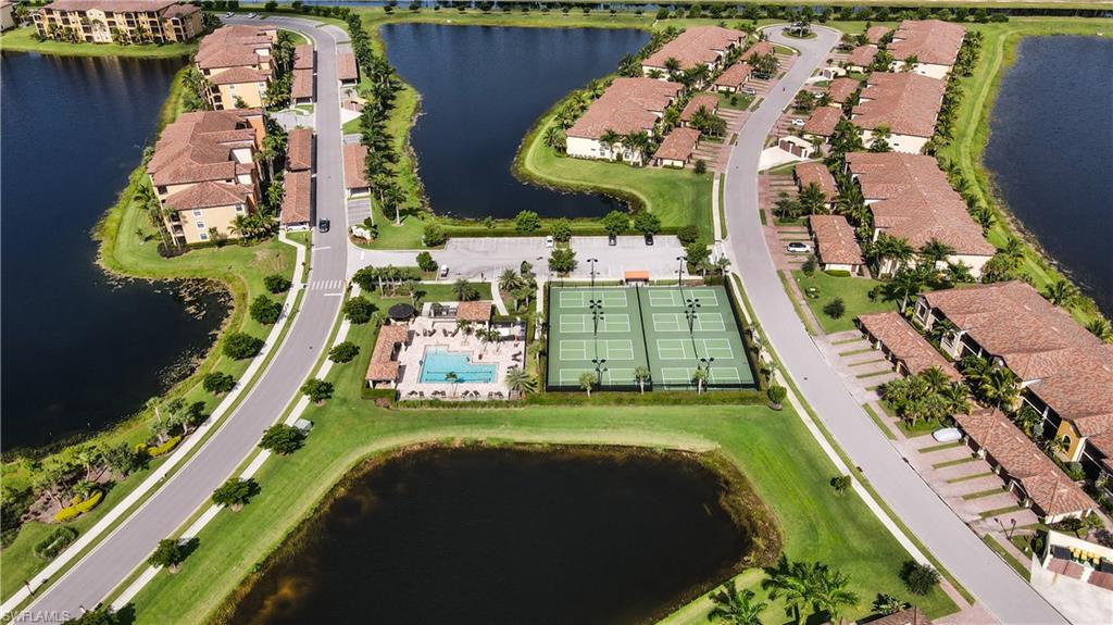 9514 Avellino Way, Unit 2116 Naples, FL 34113 - Photo 28 of 28 an aerial view of a swimming pool with a garden and plants