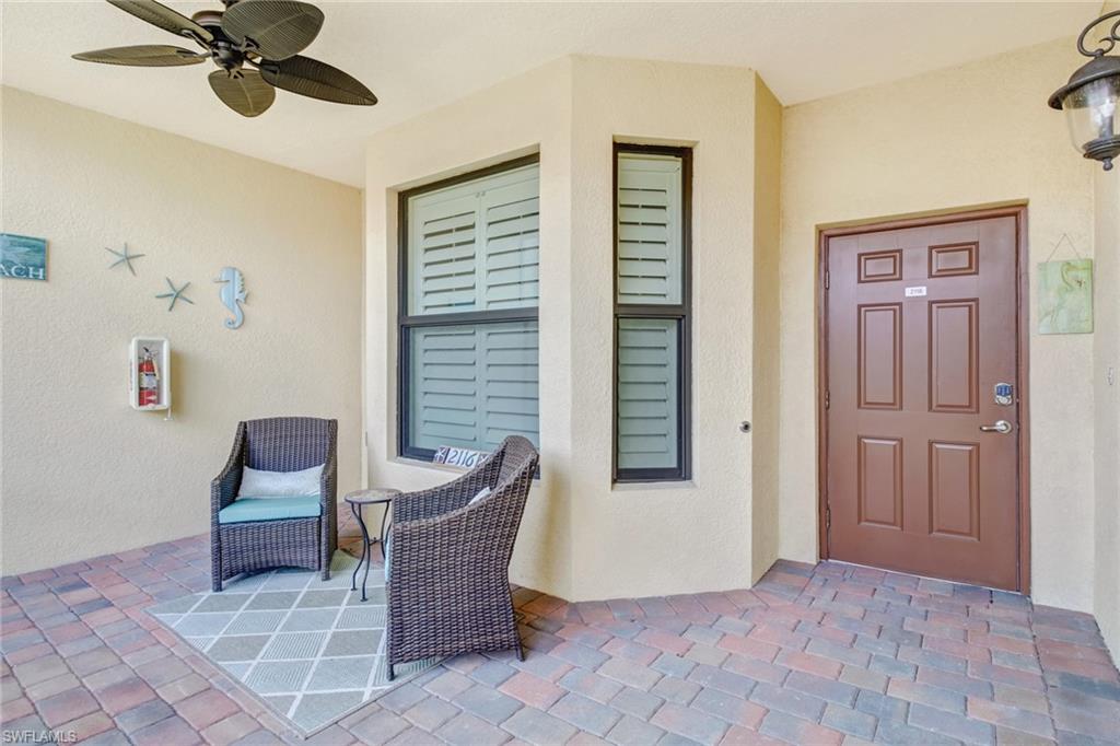 9514 Avellino Way, Unit 2116 Naples, FL 34113 - Photo 4 of 30 a living room with furniture and a window