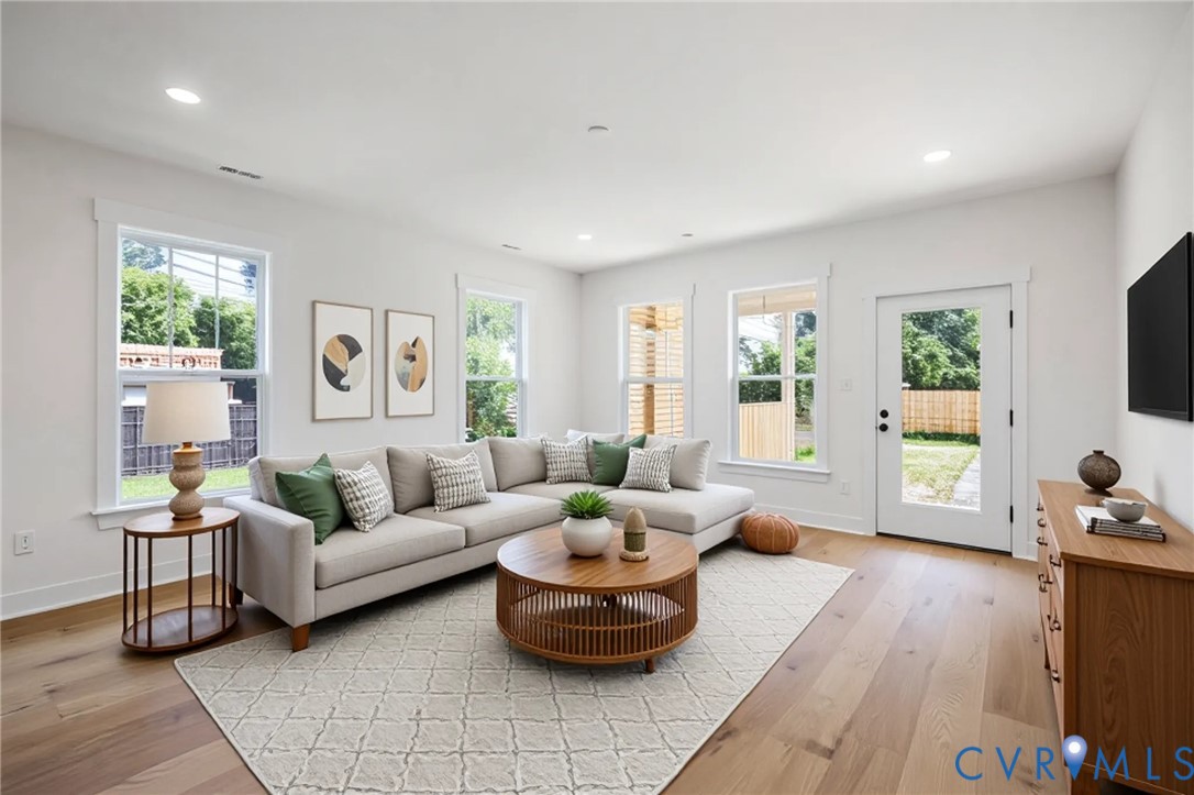 3423 Stuart Avenue Richmond, VA 23221 - Photo 15 of 34 a living room with furniture and a large window