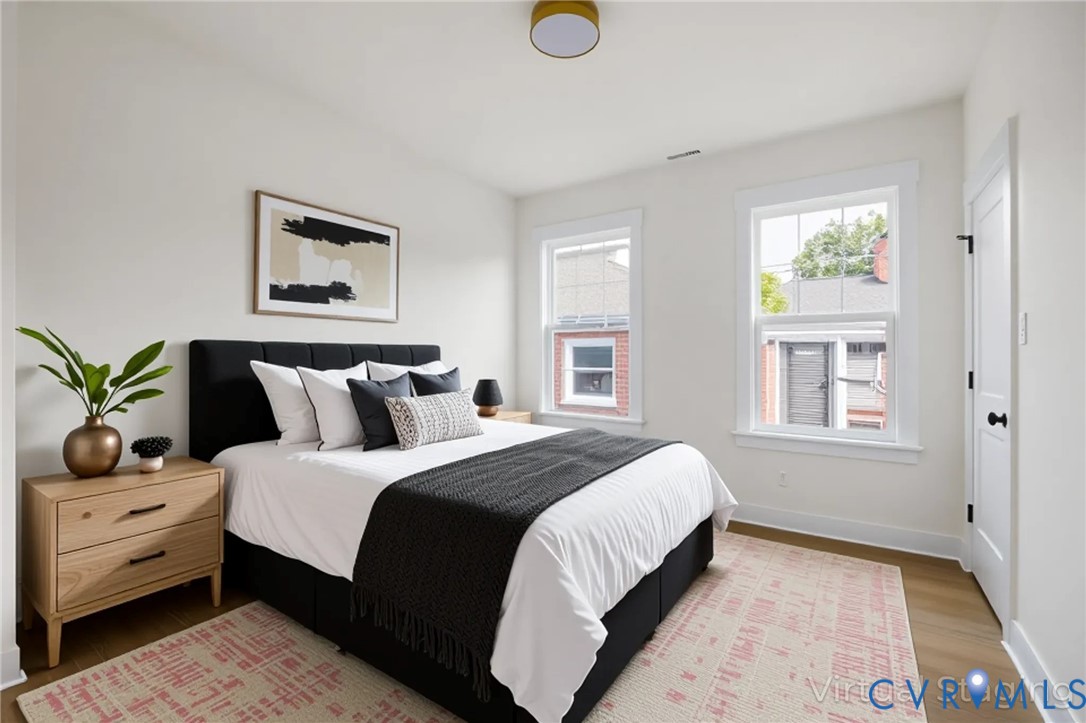 3423 Stuart Avenue Richmond, VA 23221 - Photo 29 of 34 a bedroom with bed and window
