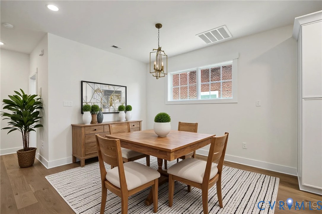 3423 Stuart Avenue Richmond, VA 23221 - Photo 7 of 34 a view of a dining room with furniture window and wooden floor