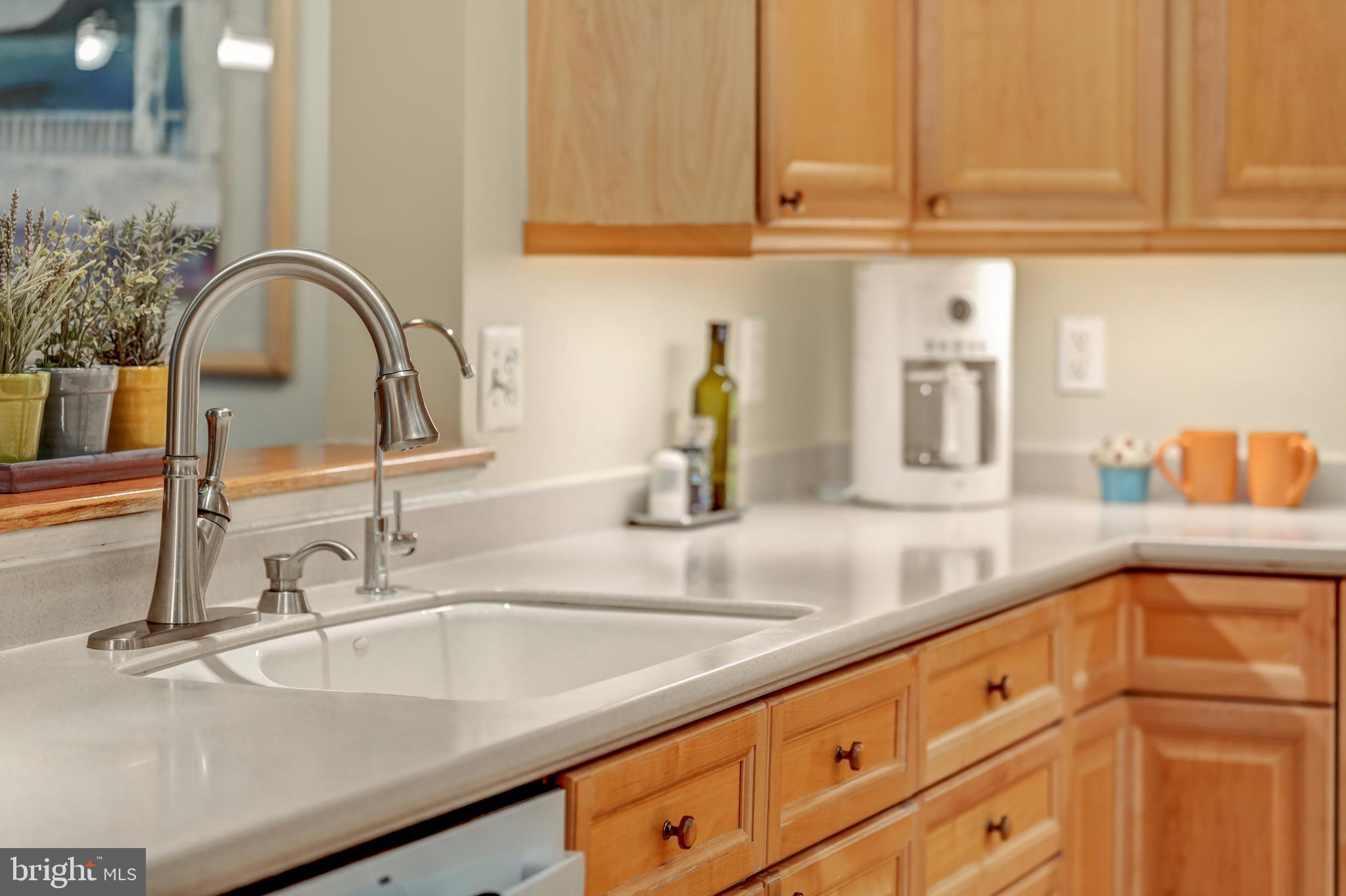 1925 Logan Manor Drive Reston, VA 20190 - Photo 16 of 61 a kitchen with granite countertop a sink and cabinets
