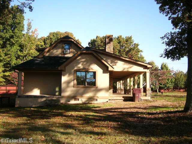 9451 Gideon Grove Road Stokesdale, NC 27357 - Photo 2 of 12 Exterior Front. Left side