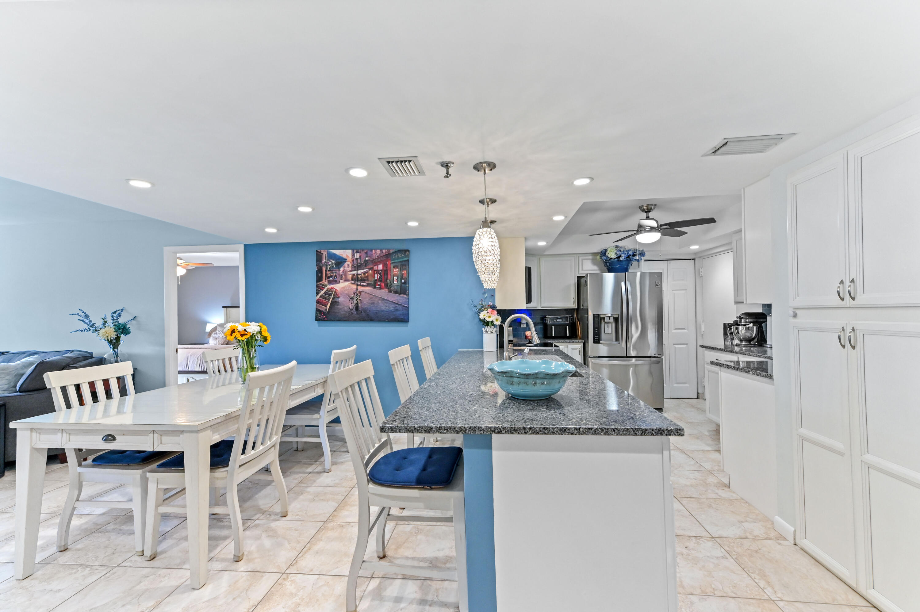 198 Northwest 67th Street, Unit 207 Boca Raton, FL 33487 - Photo 10 of 42 a view of a dining room with furniture