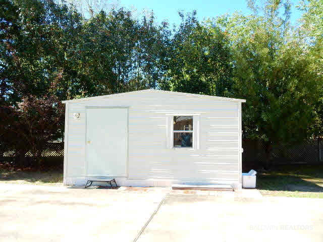 693 Escambia Loop Lillian, AL 36549 - Photo 25 of 27 shed on RV driveway