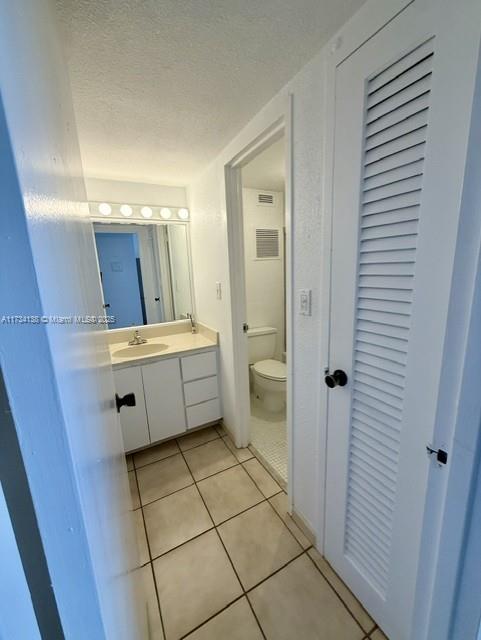 2899 Collins Avenue, Unit 1114 Miami Beach, FL 33140 - Photo 16 of 22 a bathroom with a sink a toilet and shower