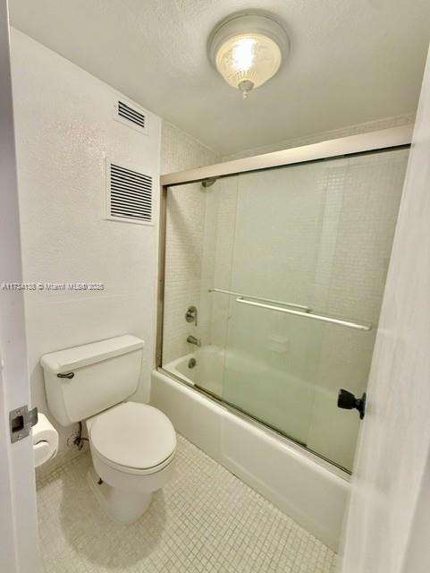 2899 Collins Avenue, Unit 1114 Miami Beach, FL 33140 - Photo 17 of 22 a bathroom with a toilet and a shower