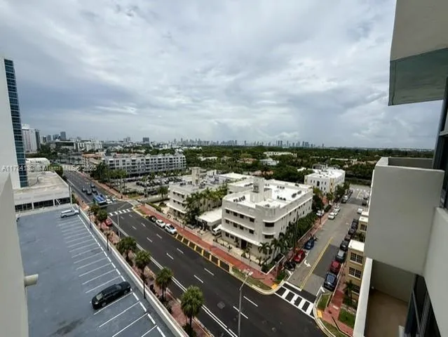 a view of a swimming pool with buildings in the background