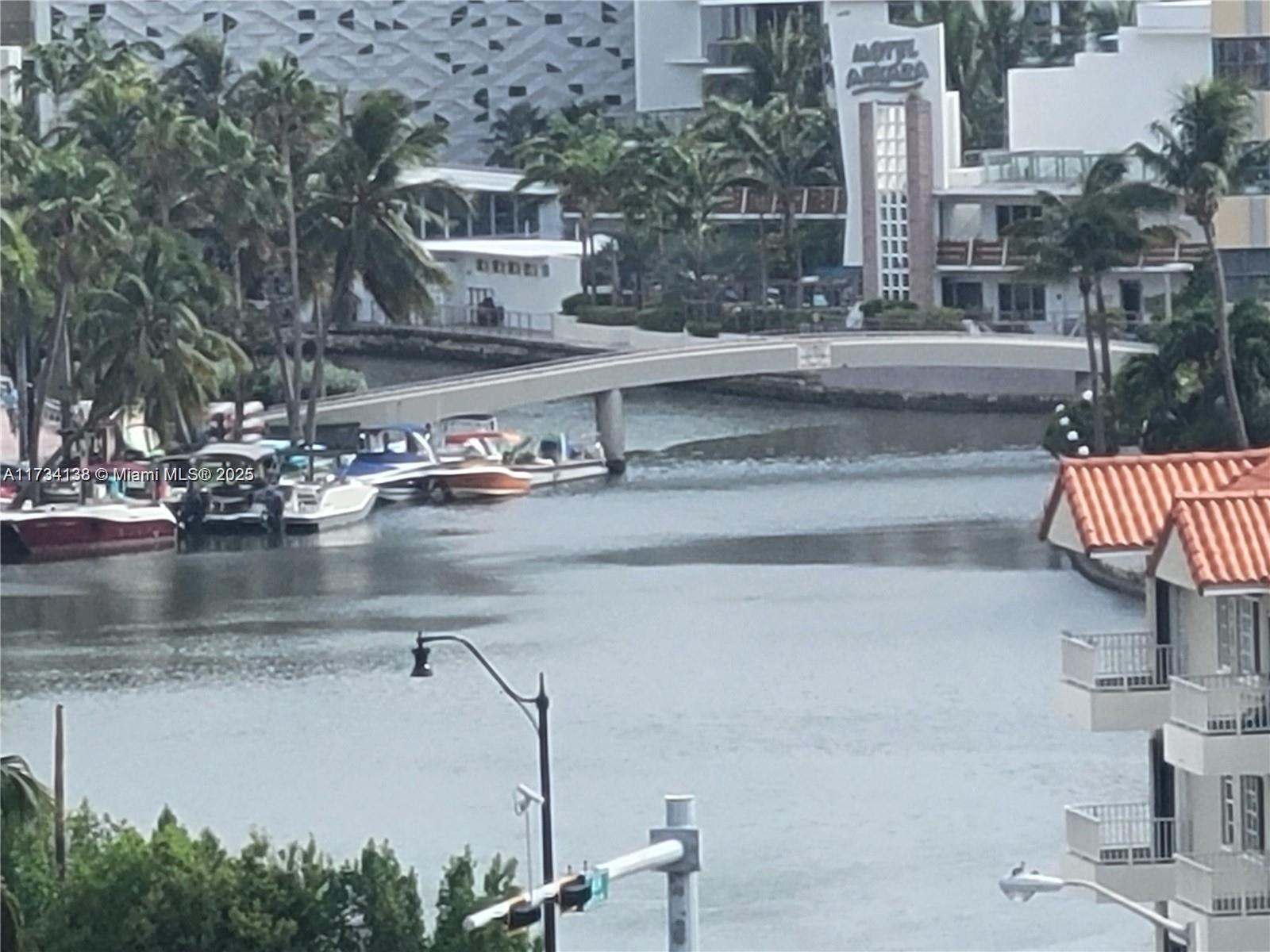 2899 Collins Avenue, Unit 1114 Miami Beach, FL 33140 - Photo 2 of 22 a view of building and car parked
