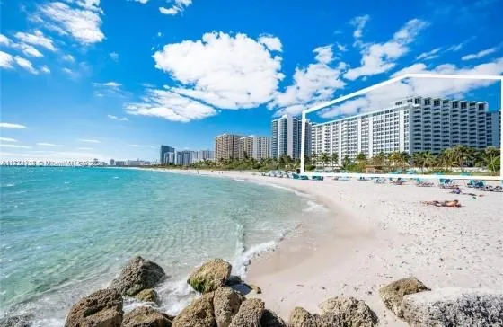 a kitchen with a refrigerator and cabinets