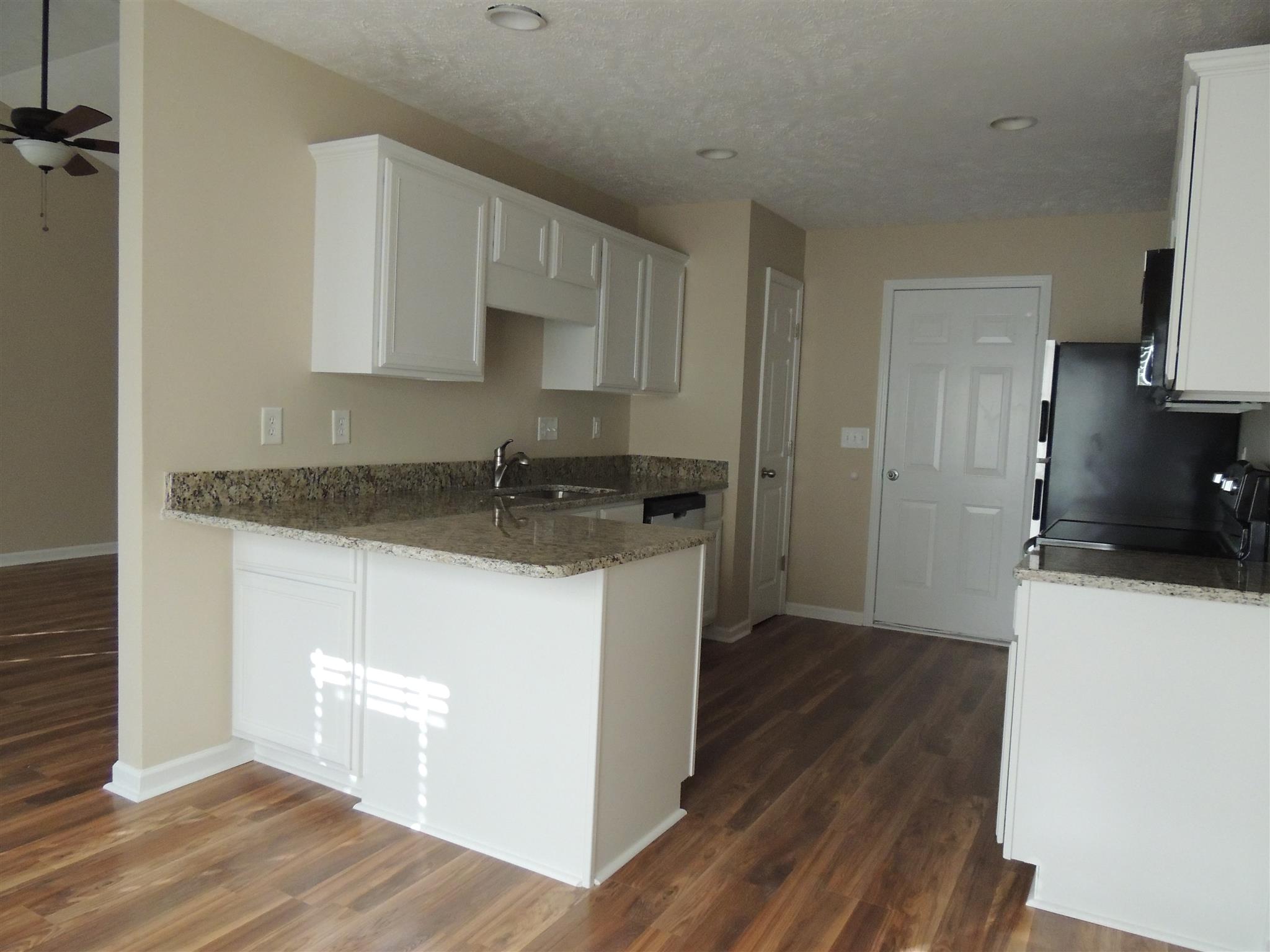 3504 Flora Drive Spring Hill, TN 37174 - Photo 13 of 17 a kitchen with a refrigerator and a stove top oven