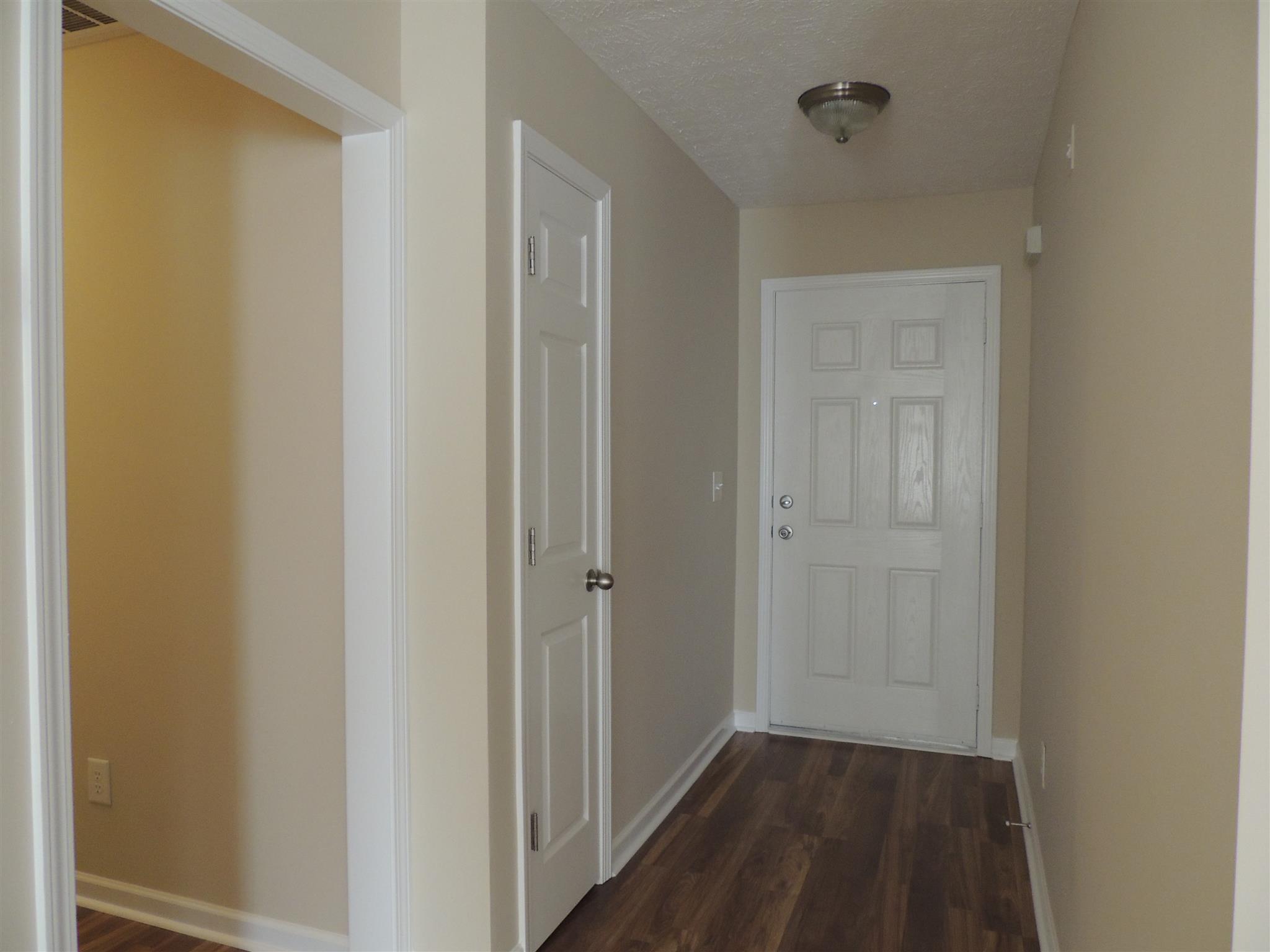 3504 Flora Drive Spring Hill, TN 37174 - Photo 8 of 17 a view of a hallway with wooden floor