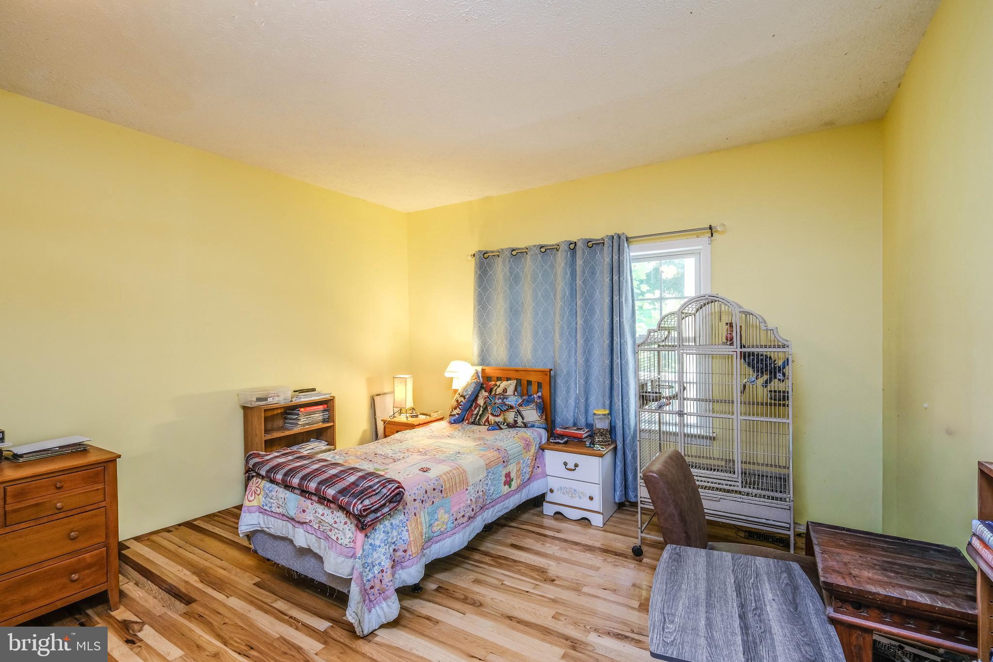 1195 Shangri-La Road Bentonville, VA 22610 - Photo 23 of 64 a bedroom with a bed and wooden floor