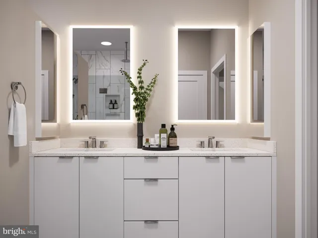 a bathroom with double sink and a mirror