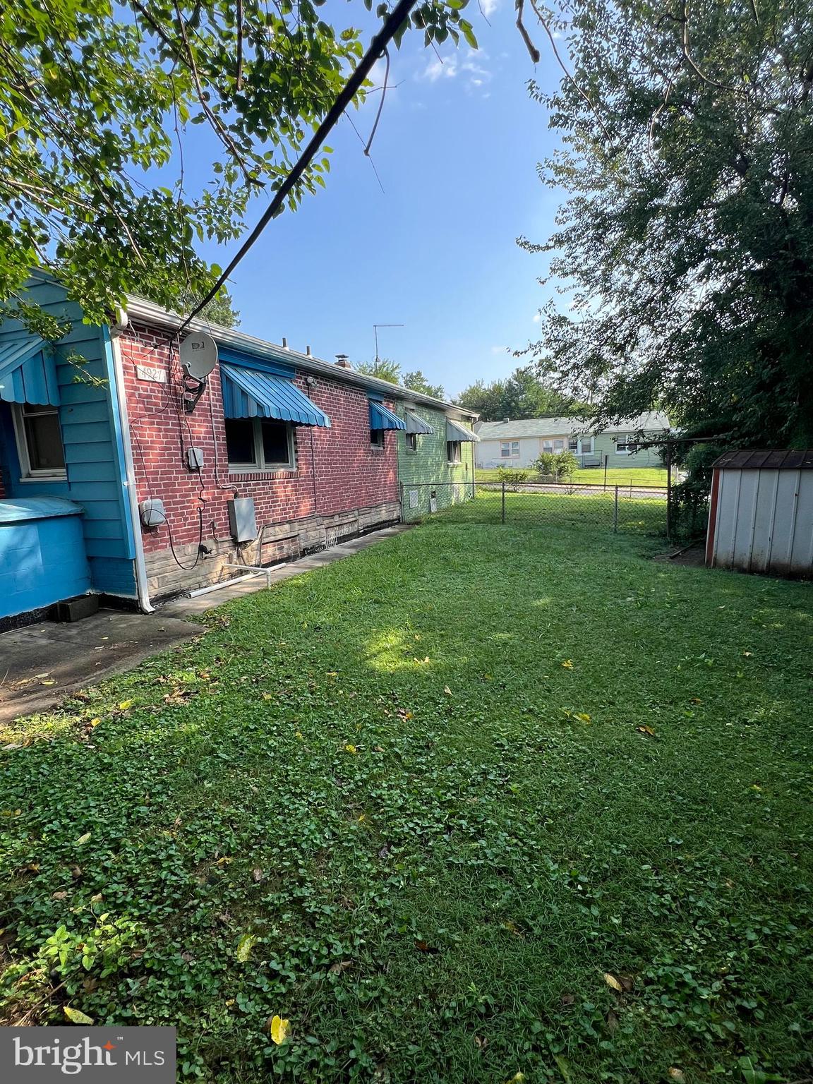 4927 Wilbur Avenue Baltimore, MD 21205 - Photo 3 of 18 a backyard of a house with table and chairs