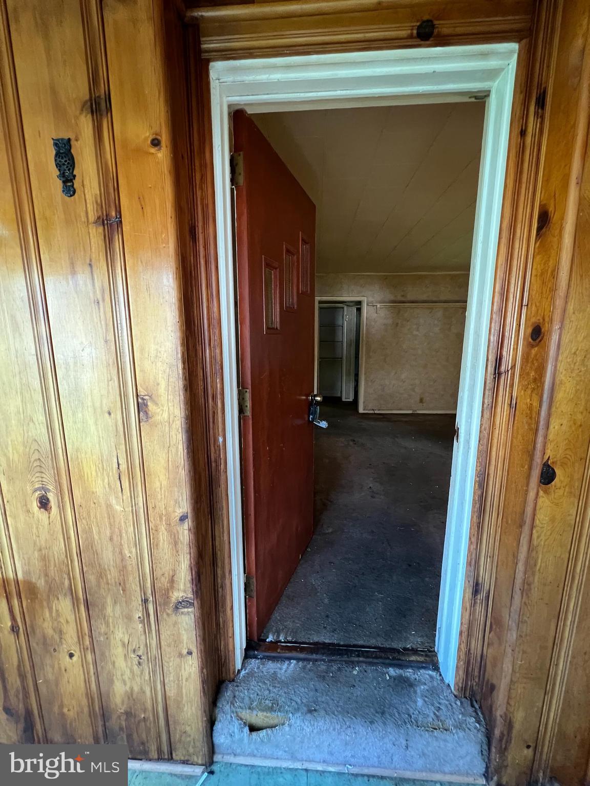 4927 Wilbur Avenue Baltimore, MD 21205 - Photo 7 of 18 a view of a hallway with wooden floor and staircase