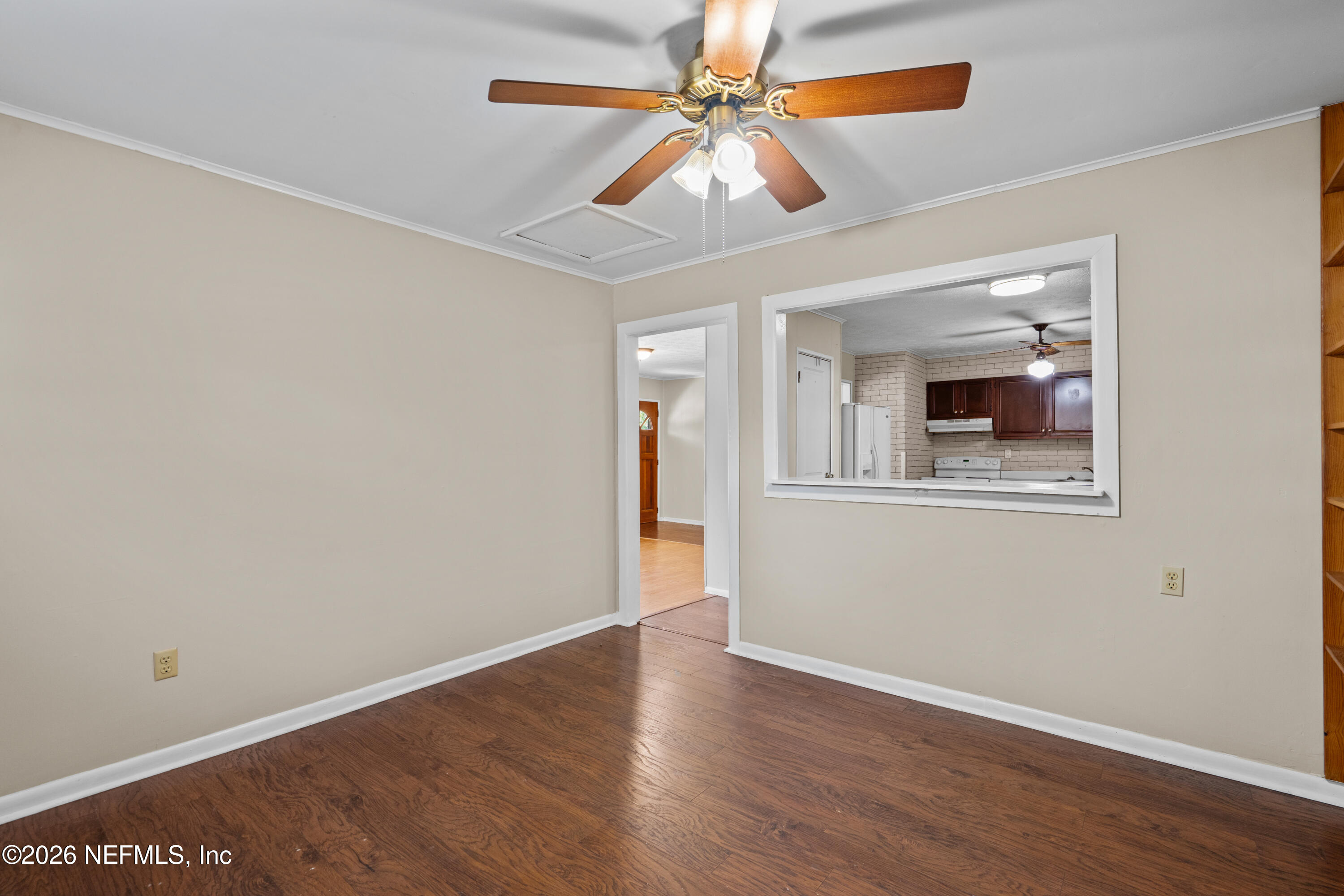 253 Cowry Road St. Augustine, FL 32086 - Photo 12 of 27 wooden floor in an empty room with a window