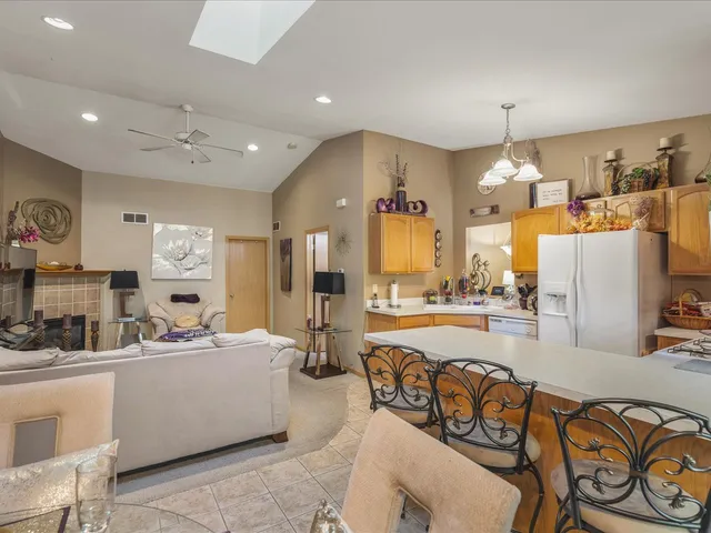 a bathroom with a granite countertop sink a toilet and a mirror