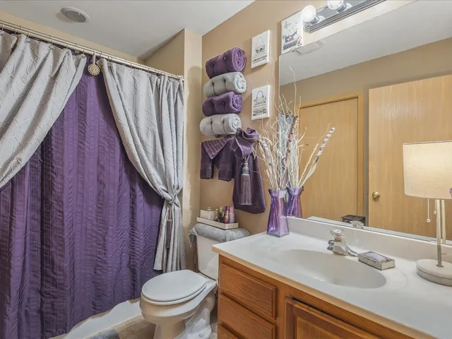 a balcony view with two chairs and a table