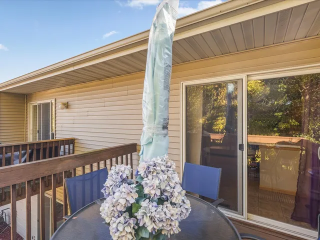 a view of a balcony with furniture