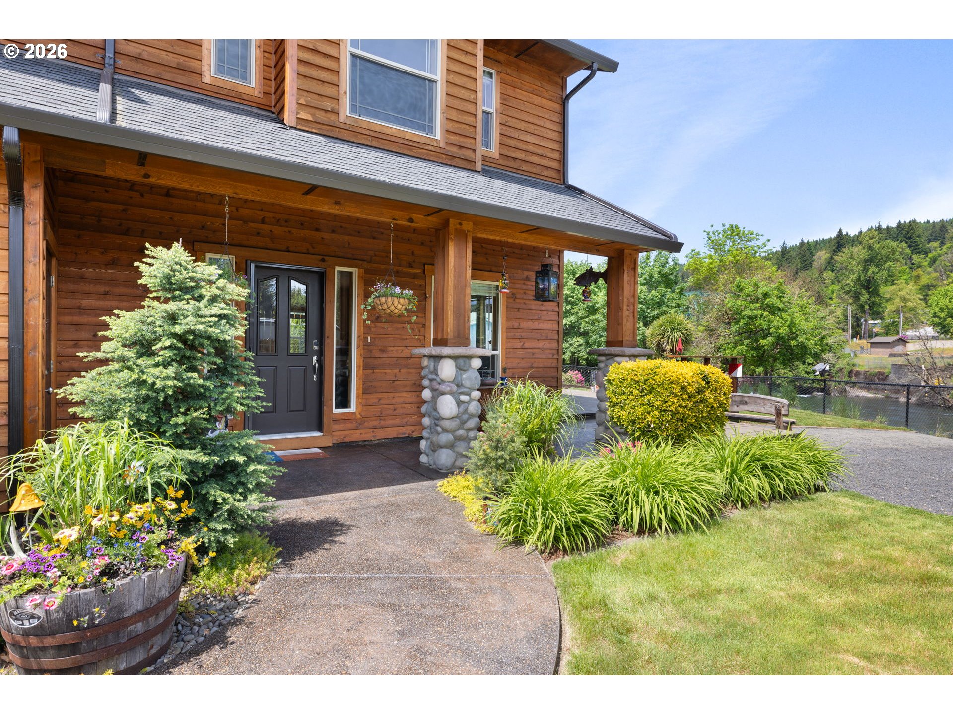 210 Southeast Whitten Road Mill City, OR 97360 - Photo 3 of 48 a view of a house with potted plants
