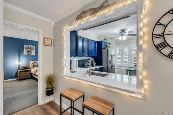 a kitchen with stainless steel appliances granite countertop a sink refrigerator and cabinets