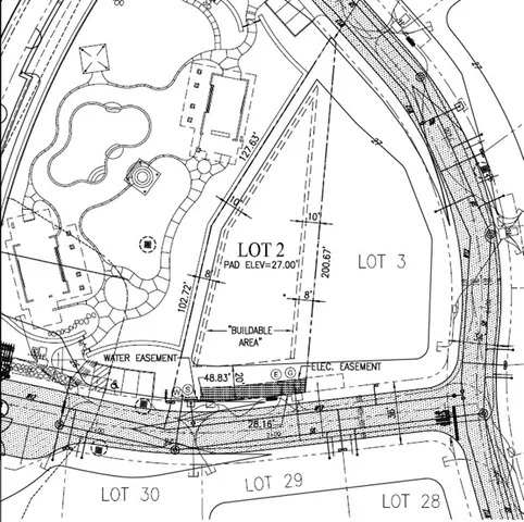 a view of swimming pool with seating area