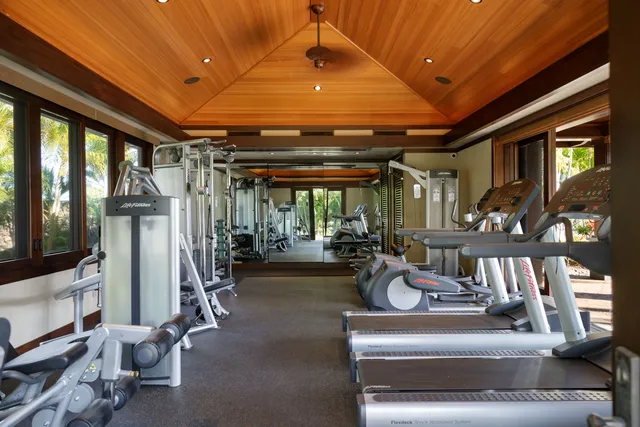 a view of a patio with couches table and chairs and potted plants