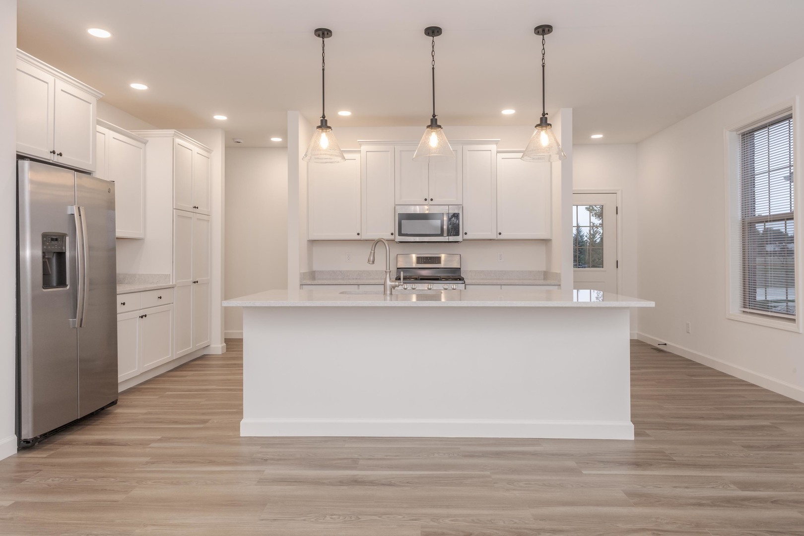 1334 Monterey Pine Drive, Unit 1334 Normal, IL 61761 - Photo 15 of 51 a large kitchen with stainless steel appliances kitchen island a large island in the center