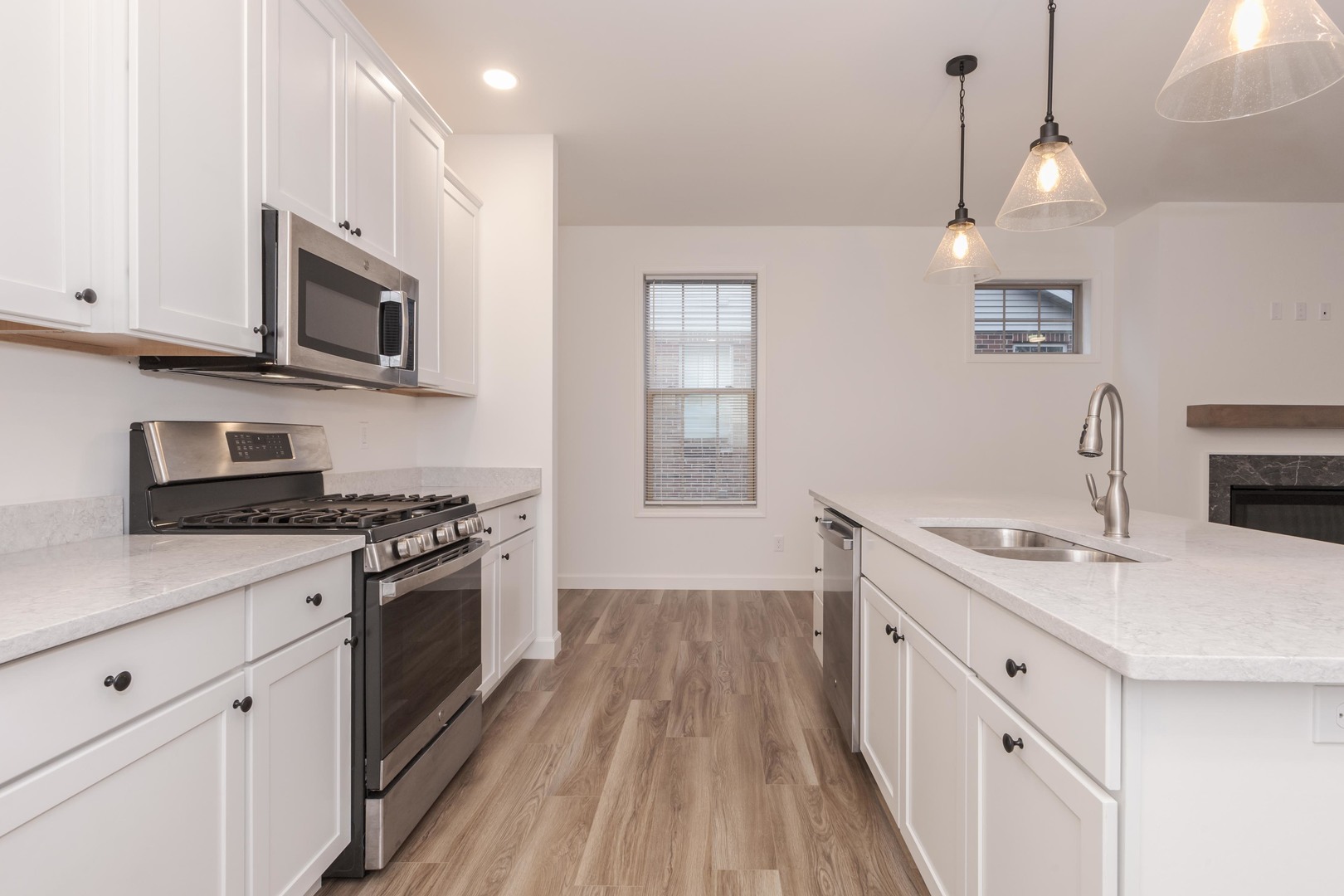 1334 Monterey Pine Drive, Unit 1334 Normal, IL 61761 - Photo 19 of 51 a kitchen with stainless steel appliances granite countertop a sink stove and microwave
